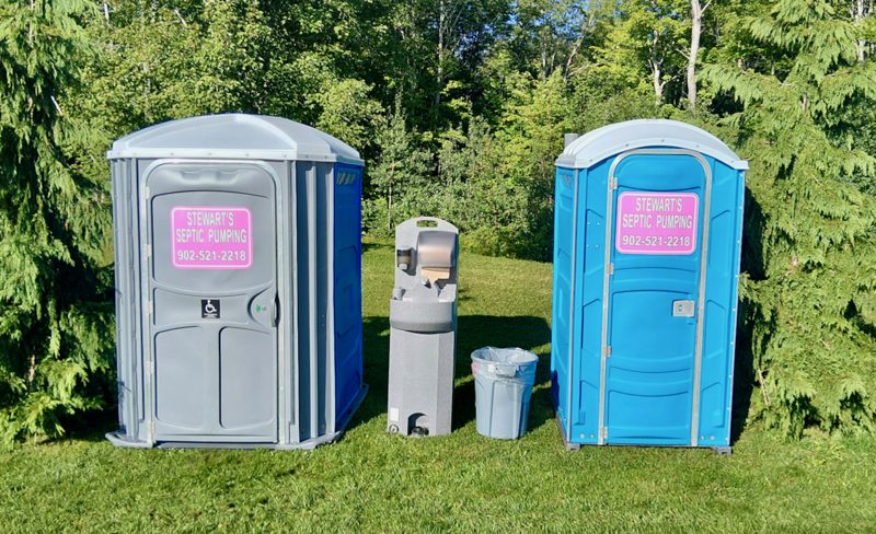 A Stewart's accessible portable toilet, hand wash station and standard portable toilet